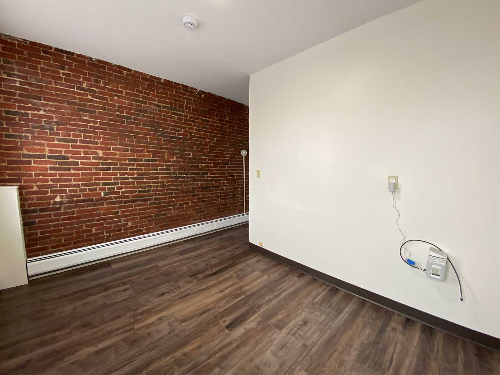 Studio with brick accent wall