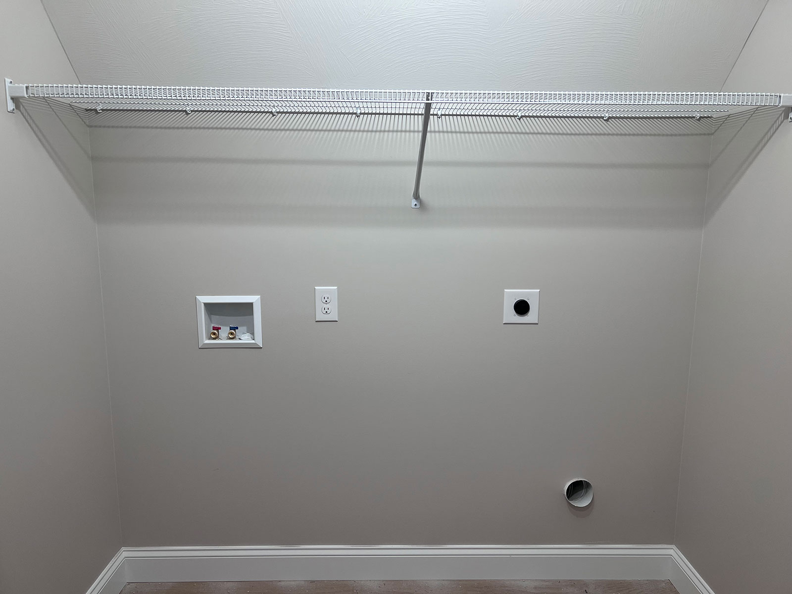 Space for washer and dryer with shelf